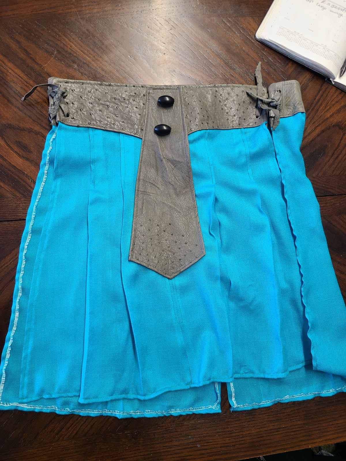 Untitled — Pleated Skirt with Leather Panel (title to be confirmed)